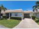 Charming single-story home with a well-manicured lawn and a covered carport at 6150 Midnight Pass Rd # V4, Sarasota, FL 34242