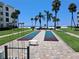 Community shuffleboard and picnic area, steps away from a sandy beach at 6150 Midnight Pass Rd # V4, Sarasota, FL 34242