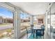 Enclosed patio offers outdoor dining with a view of the community near the beach at 6150 Midnight Pass Rd # V4, Sarasota, FL 34242