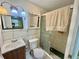 Bathroom with tiled shower, sink, and mirror cabinet at 616 63Rd W Ave, Bradenton, FL 34207