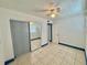 Bedroom with mirror closet doors and ceiling fan at 616 63Rd W Ave, Bradenton, FL 34207