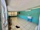 Large enclosed bonus room with tile floors, utility sink, and view to back yard at 616 63Rd W Ave, Bradenton, FL 34207