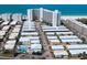 Aerial view of the home with pool and surrounding community near white sand beach and ocean at 6300 Midnight Pass Rd # 5, Sarasota, FL 34242