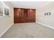 Bright bedroom featuring large custom closet and large window that offers natural light at 6300 Midnight Pass Rd # 5, Sarasota, FL 34242