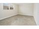 Bedroom featuring neutral walls, tile flooring, and a large window with blinds at 6300 Midnight Pass Rd # 5, Sarasota, FL 34242