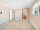 Bedroom featuring neutral walls, tile flooring, and doorways to other rooms and bathroom at 6300 Midnight Pass Rd # 5, Sarasota, FL 34242