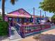 Whimsical fudge shop with colorful exterior, awnings, and an inviting entrance at 6300 Midnight Pass Rd # 5, Sarasota, FL 34242