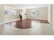 Bright living area featuring neutral walls, tile flooring, wood flooring, and a ceiling fan at 6300 Midnight Pass Rd # 5, Sarasota, FL 34242