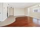 Spacious living room with neutral walls, tile flooring, wood flooring, and ample natural light at 6300 Midnight Pass Rd # 5, Sarasota, FL 34242