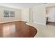 Bright living area featuring neutral walls, tile and wood flooring, a ceiling fan, and ample natural light at 6300 Midnight Pass Rd # 5, Sarasota, FL 34242