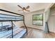 Functional bedroom featuring a bunk bed, wood-look flooring, and a ceiling fan at 6332 7Th E Ct, Bradenton, FL 34203