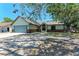 Inviting single-story home showcasing a well-maintained exterior with a two-car garage and a front lawn at 6332 7Th E Ct, Bradenton, FL 34203
