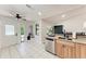 A clean and spacious kitchen with stainless steel dishwasher and access to the backyard at 6332 7Th E Ct, Bradenton, FL 34203