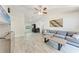 Open concept living room with wood-look floors, leading to the dining area at 6332 7Th E Ct, Bradenton, FL 34203