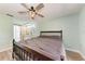 A large main bedroom featuring an ensuite bathroom with a sliding barn door at 6332 7Th E Ct, Bradenton, FL 34203
