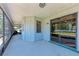 Enclosed porch with painted floors and screening offering additional outdoor living space at 6332 7Th E Ct, Bradenton, FL 34203