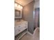 Bathroom with new vanity, sink, lighting and a shower stall in the background at 6360 Jordan St, North Port, FL 34287