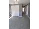 Bedroom features tile flooring, white closets, and neutral paint, creating a calming atmosphere at 6360 Jordan St, North Port, FL 34287