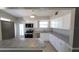Well-equipped kitchen features stainless steel appliances, white cabinets and neutral countertops at 6360 Jordan St, North Port, FL 34287