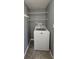 Efficient laundry space with a washing machine and practical shelving for organization at 6360 Jordan St, North Port, FL 34287