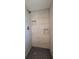 Walk-in shower with tiled walls and mosaic tile flooring at 6360 Jordan St, North Port, FL 34287
