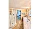 Bathroom featuring a glass shower, vanity, and decor that leads to another room at 72 4Th Ave # 72, Venice, FL 34285
