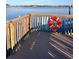 View of wooden dock with a life preserver, offering waterfront access and picturesque water views at 72 4Th Ave # 72, Venice, FL 34285
