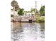 Scenic waterfront featuring a wooden dock with direct access to the calm canal waters at 72 4Th Ave # 72, Venice, FL 34285