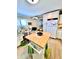 Functional kitchen with ample storage, white appliances, a center island and adjacent desk area at 72 4Th Ave # 72, Venice, FL 34285