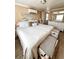Serene main bedroom boasts large bed, beach decor, generous storage and a calming ambiance at 72 4Th Ave # 72, Venice, FL 34285