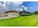 Backyard with manicured lawn and outbuilding at 8402 13Th Nw Ave, Bradenton, FL 34209