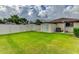 Spacious backyard features a privacy fence, shed, and lush lawn at 8402 13Th Nw Ave, Bradenton, FL 34209