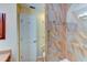 Bathroom with tiled shower, grab bar, and a standard toilet at 8402 13Th Nw Ave, Bradenton, FL 34209