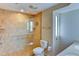 Elegant bathroom with a glass-enclosed shower, grab bars, and double sinks at 8402 13Th Nw Ave, Bradenton, FL 34209