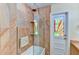 Beautifully tiled bathtub and shower with unique stained-glass door to the backyard at 8402 13Th Nw Ave, Bradenton, FL 34209