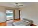 Bright bedroom with hardwood floors and sliding glass doors to the pool area at 8402 13Th Nw Ave, Bradenton, FL 34209