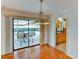 Dining room features hardwood floors and view of screened pool and dining area at 8402 13Th Nw Ave, Bradenton, FL 34209