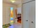 Warm entryway with colorful stained glass on front door and ceramic tiled floors at 8402 13Th Nw Ave, Bradenton, FL 34209