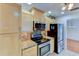 Well-equipped kitchen showcasing stainless steel appliances, granite countertops, and wood cabinets at 8402 13Th Nw Ave, Bradenton, FL 34209