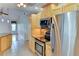 Modern kitchen with stainless steel appliances, granite countertops, and open access to the dining area at 8402 13Th Nw Ave, Bradenton, FL 34209