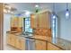 Bright kitchen features granite countertops, stainless steel appliances, and wood cabinetry at 8402 13Th Nw Ave, Bradenton, FL 34209