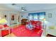Stylish living room with piano, vibrant rug, and lots of light at 8402 13Th Nw Ave, Bradenton, FL 34209