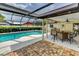 Enjoy outdoor living with a sparkling pool and screened-in lanai with a dining area at 8402 13Th Nw Ave, Bradenton, FL 34209
