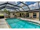 Beautiful screened-in pool area with outdoor seating and dining space for entertaining at 8402 13Th Nw Ave, Bradenton, FL 34209