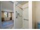 Shower stall with safety bars and view to bedroom at 8413 Lincolnshire Dr, Hudson, FL 34667