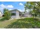Landscaped front yard of single Gathering home with stone accents on the facade at 8413 Lincolnshire Dr, Hudson, FL 34667