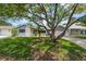 Charming single Gathering home with a large tree and a well-maintained lawn in a quiet neighborhood at 8413 Lincolnshire Dr, Hudson, FL 34667
