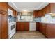 Well-lit kitchen featuring updated cabinets, backsplash, and modern appliances at 8413 Lincolnshire Dr, Hudson, FL 34667