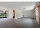 Spacious living room with carpet flooring ready for updates and personalization at 8413 Lincolnshire Dr, Hudson, FL 34667