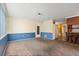 Carpeted living room features neutral paint, and bar with seating at 8413 Lincolnshire Dr, Hudson, FL 34667